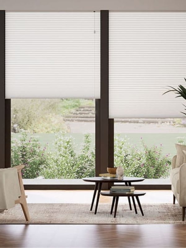 White cellular shades covering a patio door in a Vancouver home