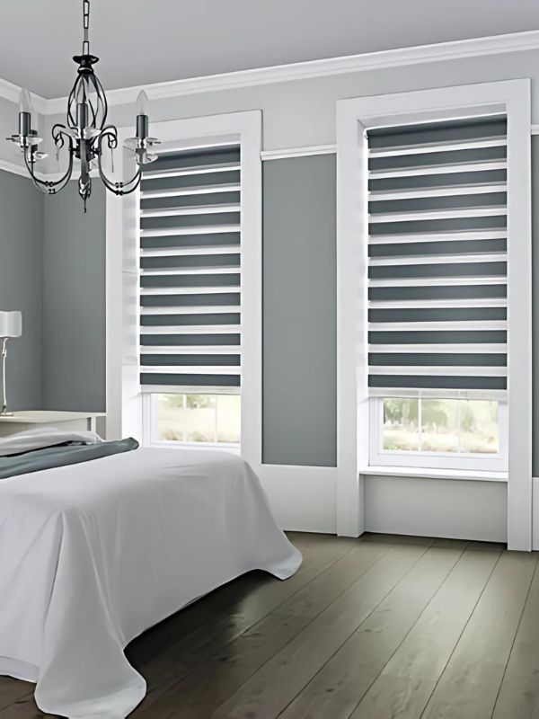 Zebra blinds adjusted for privacy in a bedroom